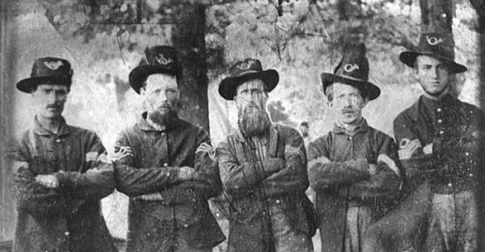 A group of men in uniform, captured by Dr. Lorien Foote for the Art of Manliness Podcast.