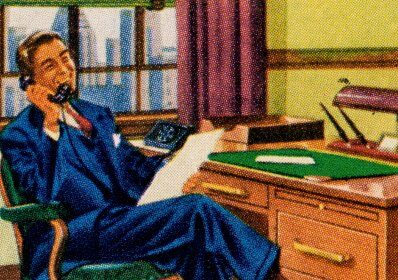 A man in a suit sitting at a desk, showcasing his importance and good resume.