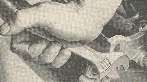 A vintage ad showcasing the mastery of toolmanship with a wrench.