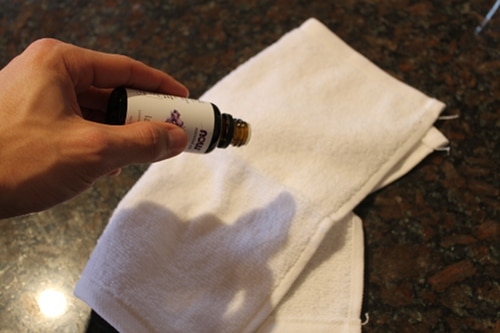 Applying lavender oil to dry Towel.