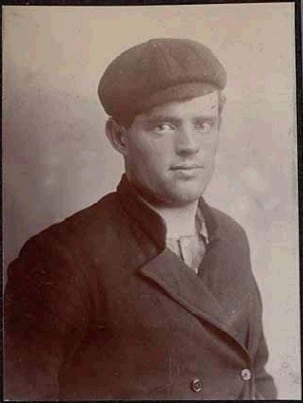 Jack London portrait flat cap overcoat.