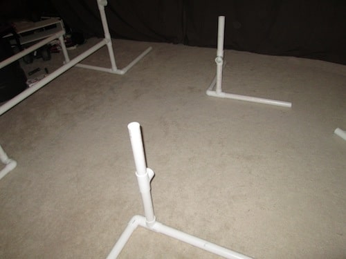Step 11: Insert one 1 foot PVC pipe into the top of the T sections.
