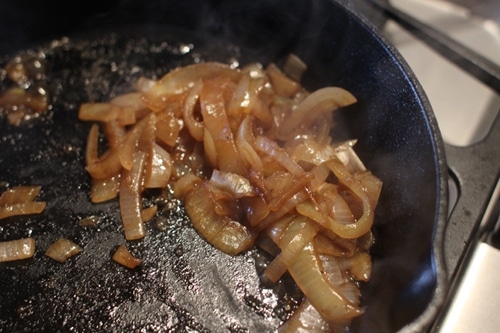 Vintage fried onions in pan.