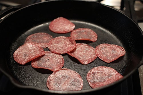 Vintage fry salami in pan.