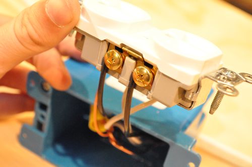 Repeat the same process of cutting, stripping and attaching the hot wires to the gold screws.