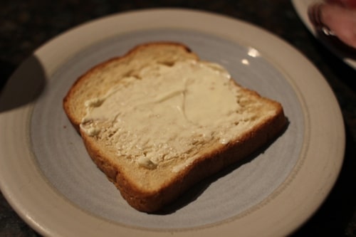 Vintage mayo on a bread over a plate.