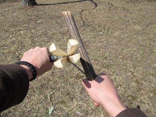 Vintage men holding knife and splitting into quarters.