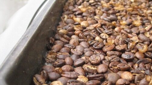 A home coffee roast on top of a stove.