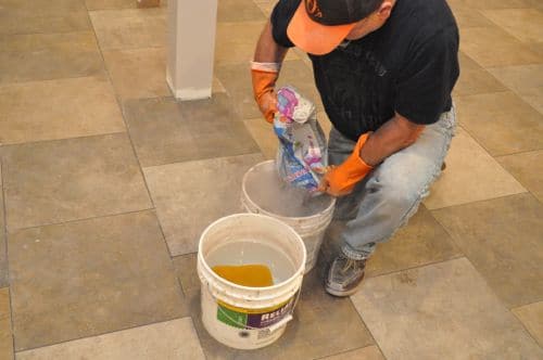 Mixing grout in buckets.