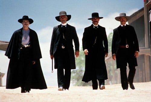 Tombstone western movie walking down main street black clothes. 