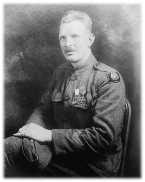 Military soldier Alvin York portrait sitting in chair.