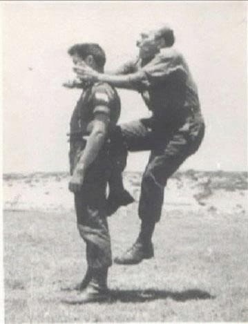 Imi Lichtenfeld, founder of Krav Maga practicing moves on soldier