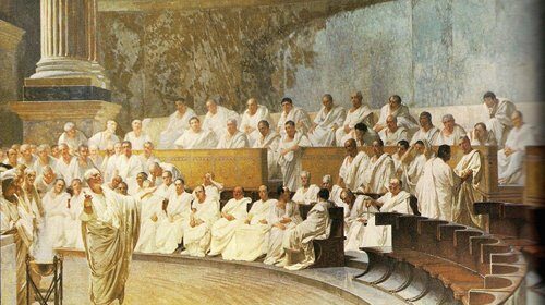 A painting capturing a group of people sitting in a room, featuring men conversing and adorned with Latin words.