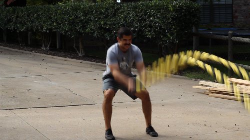 Vintage man moving his double arm for burpee.