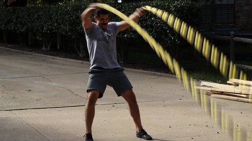 Vintage men moving his double arms for outside circles.