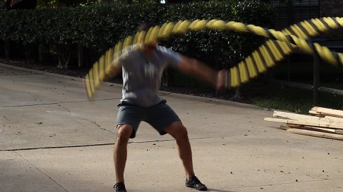 Vintage men moving his double arms for outside circles.