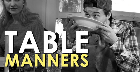 A man and woman demonstrating proper table manners while dining.