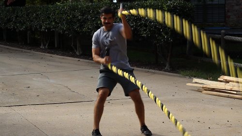 Vintage man moving his double arm for uppercuts.