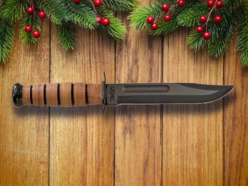 USMC knife with christmas background.