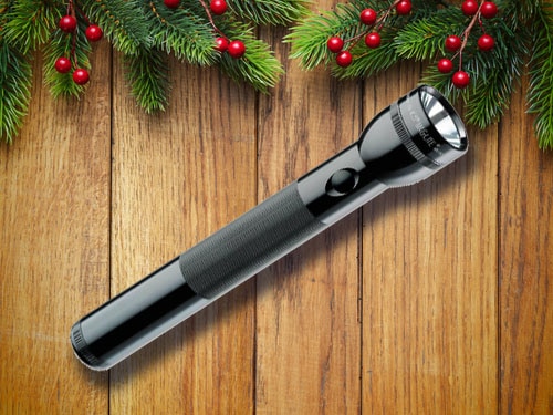 Maglite flashlight with christmas background.