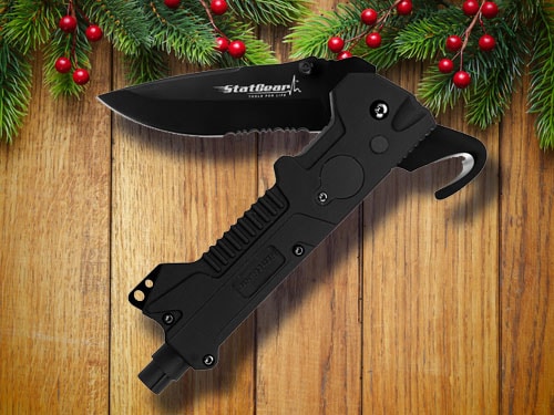 Tactical auto rescue tool with christmas background.