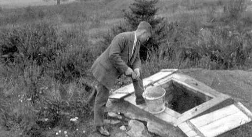 Using his strength, a man digs deep and pours water into a hole in the ground - showcasing that he is stronger than you think.
