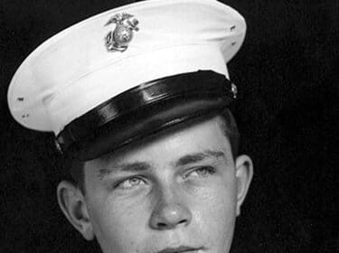 A young man toughened himself in a military uniform.