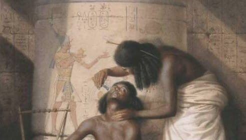 A painting capturing an ancient Egyptian ritual of a woman grooming a man