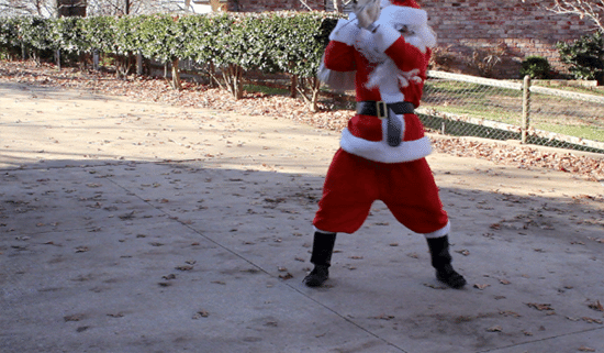 Man wearing red dress and picked a sack bag at his shoulder.