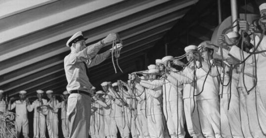 A group of men standing in a line.