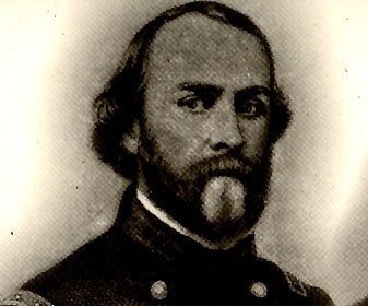 A soldier in uniform, with a beard, holding a love letter.