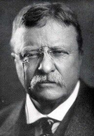 An old photo of Theodore Roosevelt, a man with glasses and a mustache.