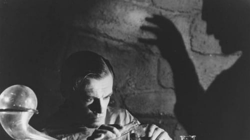 Victor Frankenstein is making a potion at a table while contemplating the lessons of unmanliness.