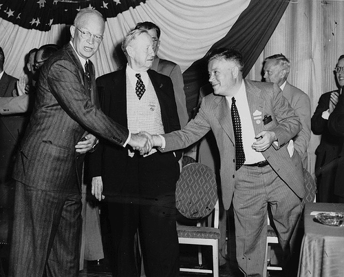 Vintage men shaking hands meeting.