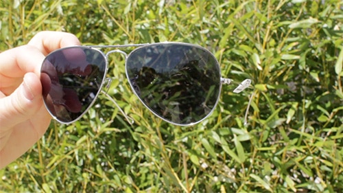 A man seeing the shades of dark gray lenses.