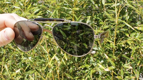 A man seeing the shades of green lenses.