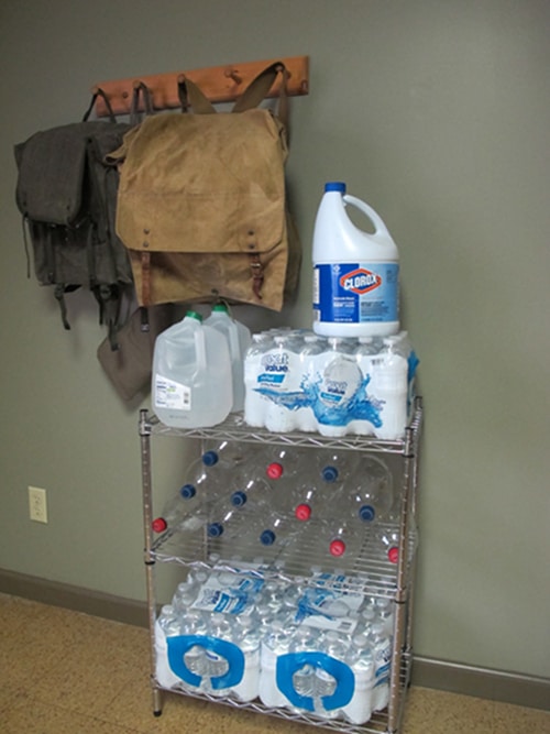 Bags are hang with wall hanger and Storing bottled water for an emergency supply in stain.