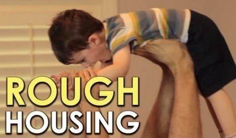 During a roughhousing session, Dr. Anthony DeBenedet playfully holds a child up to his head.