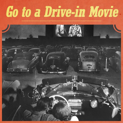 Vintage couple sitting in car and watch movie. 