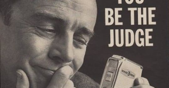 A man holding an electric razor with the words you be the judge.