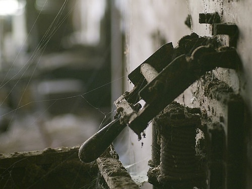 Vintage electrical switch cobwebs dusty.