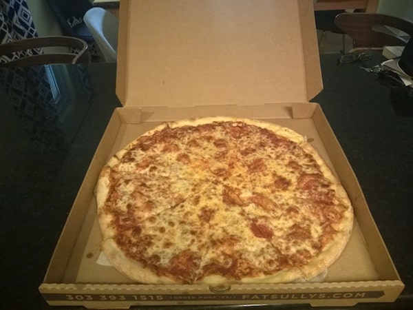 Fat sully's pepperoni pizza placed in a box. 
