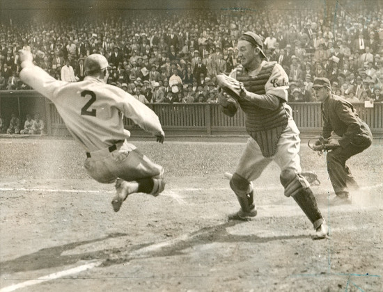 Vintage baseball player jumping over the ground.