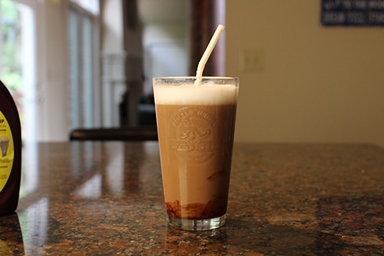 Brown chocolate and straw in the glass.