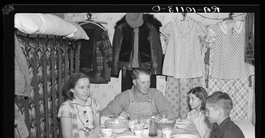 During lean season, a family gathers around the table and enjoys dinner together.