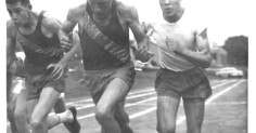 Men responding to the challenge of stress by running on a track.