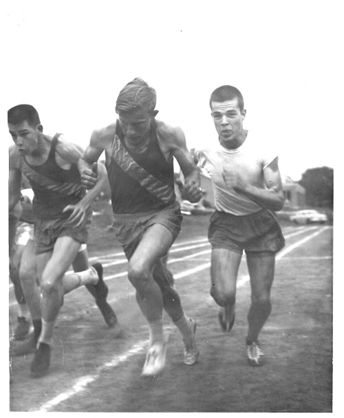 Men responding to the challenge of stress by running on a track.