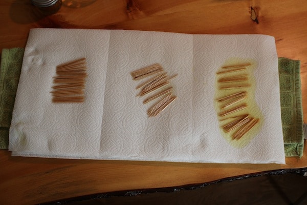 Diy flavored toothpicks drying on paper towels.