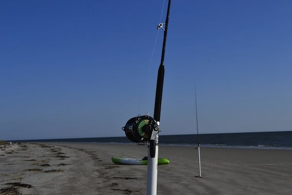 A view of fish rod in front of beach.