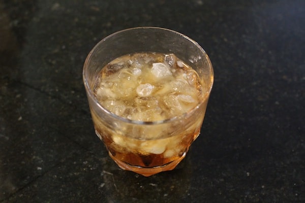 Crushed ice in whiskey glass. 